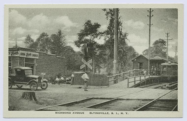 Richmond Avenue, Eltingville, S.I., N.Y. [R.R. crossing, station, train at platform, old car stopped by tracks, "Reid's" soda-drug-ice cream store on street]