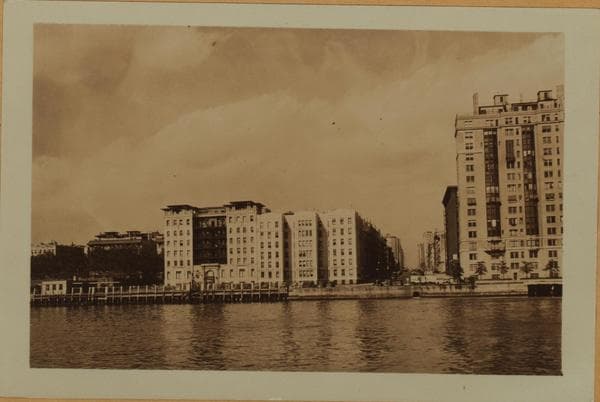 East River - Shore and skyline of Manhattan between East 76th and 80th Streets - Queensborough Bridge - [East End Hotel for Women - Yorkgate.], 1933–1935